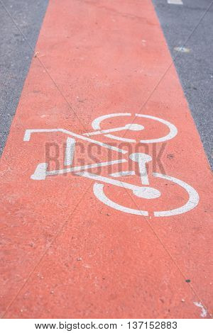 Bicycle sign on the red bicycle lane.