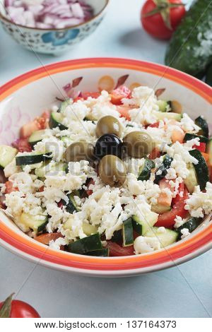 Shopska salad with white cheese, olives, cucumber, tomato and onion