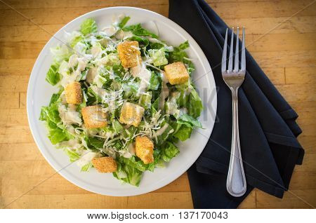 Fresh organic caesar salad with grated asiago cheese