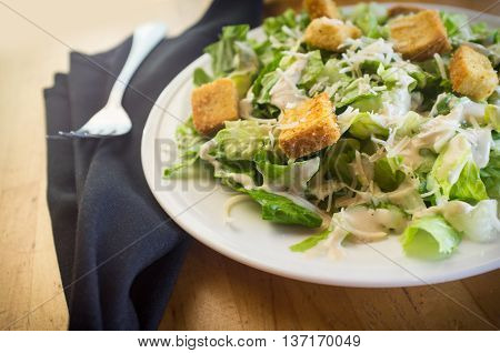 Fresh organic caesar salad with grated asiago cheese