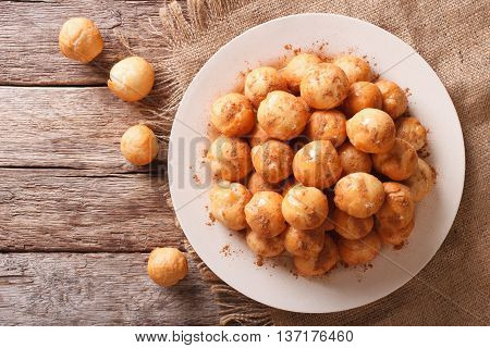 Loukoumades Donuts With Honey And Cinnamon Close-up. Horizontal Top View