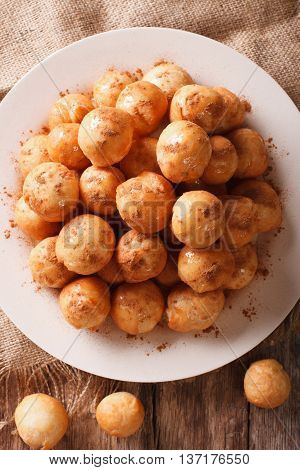 Greek Loukoumades Donuts With Honey And Cinnamon Closeup. Vertical Top View