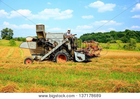 farm machinery antique combine grain wheat oats summer harvesting