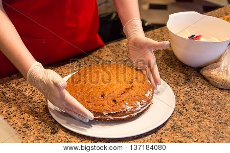 cooking homemade cake in restaurant with open kitchen