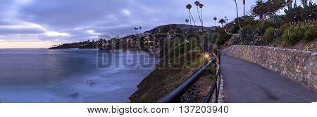 Dark clouds over Diver's Cove in Laguna Beach at sunset in the summer.