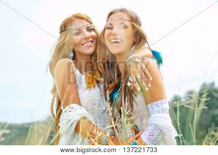 Two beautiful smilling girls. Boho style portrait
