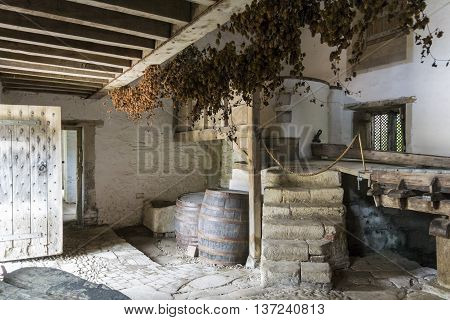 LACOCK ABBEY, LACOCK, WILTSHIRE, UK, 21 JUNE 2016 - Inside the medieval brewery at Lacock Abbey Lacock Wiltshire