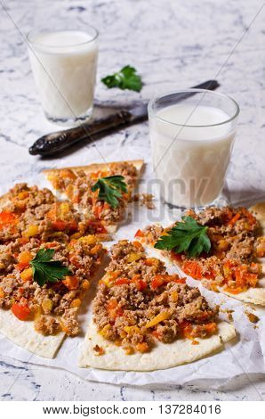 Traditional Asian thin tortilla with minced meat and vegetables. Selective focus.