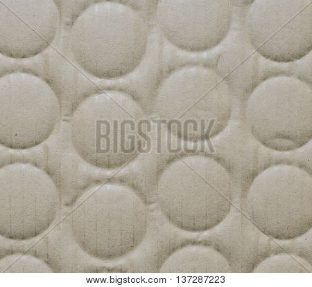 Recycled corrugated cardboard paper texture background with debossed circle shape