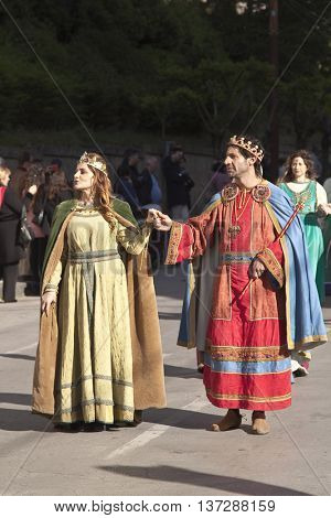 Enna, Italy - May 2016: People dressed as a King and Queen take part in the medieval costume parade along the street. Tenth Edition of Historical Parade, 15 may 2016, Enna, Sicily