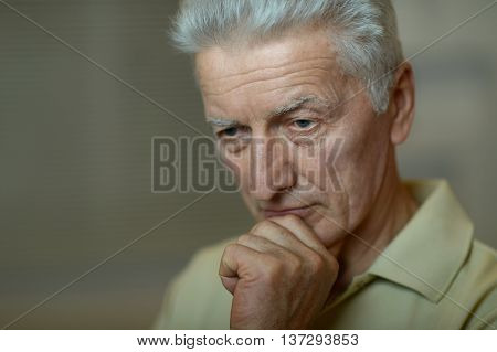 Portrait of a sad senior man face