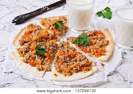 Traditional Asian thin tortilla with minced meat and vegetables. Selective focus.
