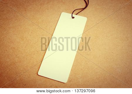 blank price tag label on wooden background