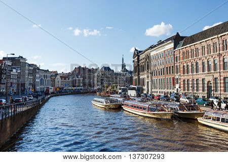 Amsterdam Netherlands - July 02 2016: View of the buildings on the Oude Turfmarkt street in Amsterdam city summer time