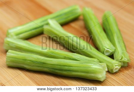 Close up of Medicinal moringa oleifera on wooden surface