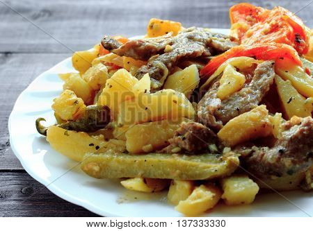 Traditional Tatar food - azu. On a white plate. Close-up