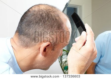 Man head with a comb.