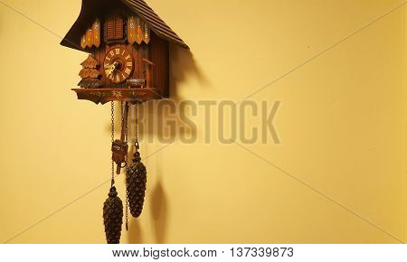 Brown wood cuckoo clock on a wall