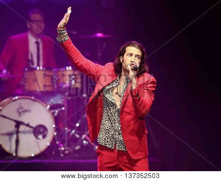 HUNTINGTON, NY-MAR 7: Singer Nasri (R) of the reggae fusion band Magic! performs in concert at The Paramount on March 7, 2015 in Huntington, New York.