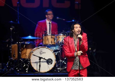 HUNTINGTON, NY-MAR 7: Singer Nasri (R) of the reggae fusion band Magic! performs in concert at The Paramount on March 7, 2015 in Huntington, New York.