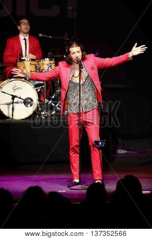 HUNTINGTON, NY-MAR 7: Singer Nasri (R) of the reggae fusion band Magic! performs in concert at The Paramount on March 7, 2015 in Huntington, New York.