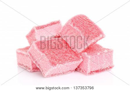 Pink candied fruit jelly on a white background
