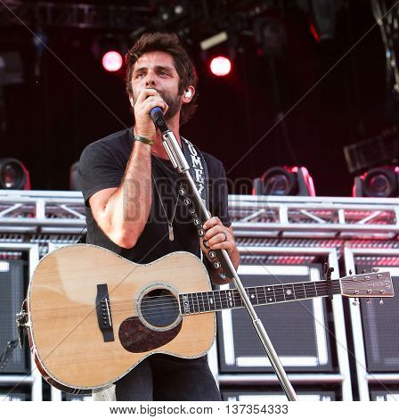 NASHVILLE-JUL 11: Country recording artist Thomas Rhett performs during Luke Bryan's 'Kick The Dust Up' Tour at Vanderbilt Stadium on July 11, 2015 in Nashville, Tennessee.