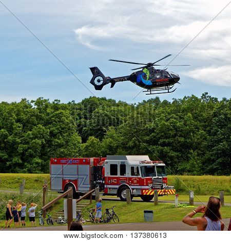 BARNESVILLE PA- JULY 3 2016: A medical helicopter flies into Locust Lake State Park to transport a person needing emergency health care.