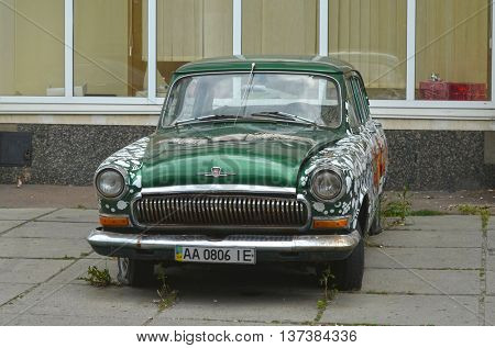  Exterior of the vintage Soviet car GAZ-21 Volga with folk stile tuning. July 6, 2016 in Kiev, Ukraine