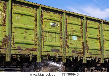 washing of freight wagons - old industrial railway junction on a summer afternoon