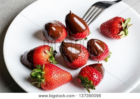 Juicy strawberry with milk chocolate