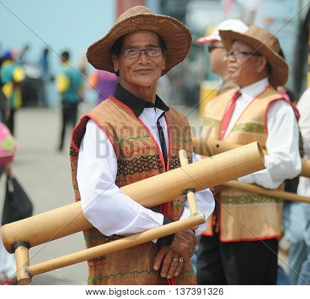 Sipitang Sabah Malaysia - Aug 30 2014:Lundayeh man in traditional costume folklore festival in Sipitang Sabah.Lundayeh is among the largest ethnic group in Sabah interior.