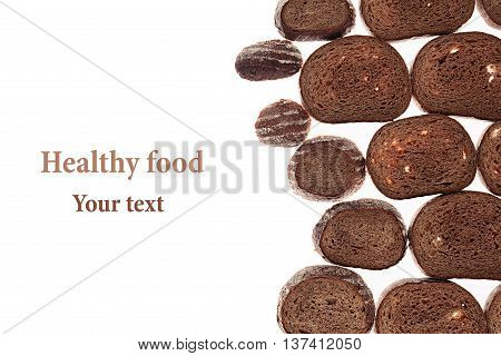 Decorative edging pieces of black rye bread on a white background. Isolated. Border. Pattern. Food background. View from above.