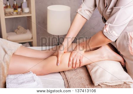 Woman having anticellulite foot massage. Spa Salon therapeutic foot massage