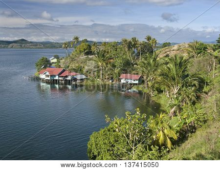 House on an island on the lake of Sentani New Guinea