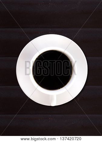 Cup of black coffee top view isolated on white background.