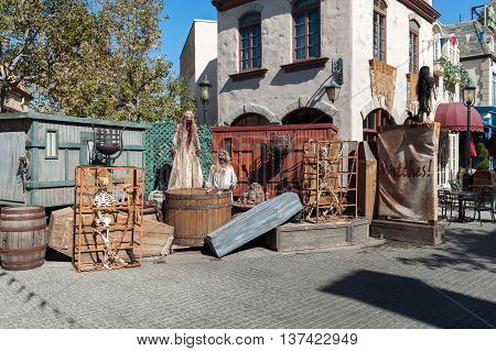 halloween outdoor composition with skeletons witches and coffin