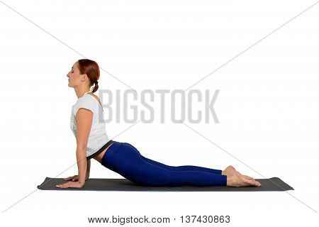 sports exercise isolated on white background. Beautiful woman dressed in sportswear trains flexibility of the body.