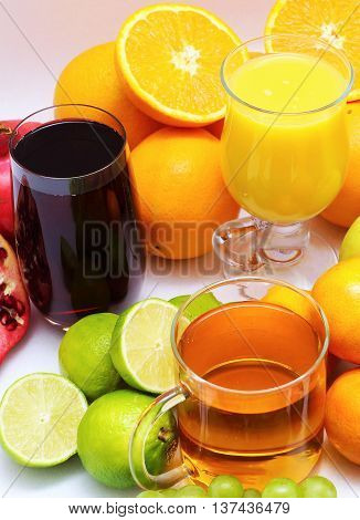 Organic fruits and fruit juice on white background