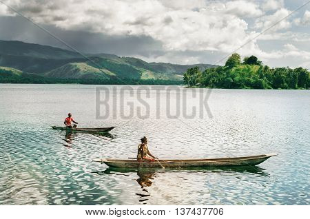 LAKE SENTANI INDONESIA - JAN 08: Fishermans catch a fish January 8 2011 at Lake Sentani Island New Guinea Indonesia.