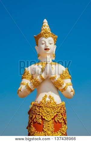 Thai graven image on blue sky background.