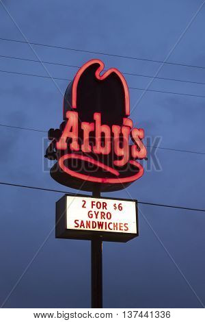 DALLAS TX USA - APR 17 2016: Arby's restaurant logo illuminated at night. Arby's is an international chain of fast food restaurants