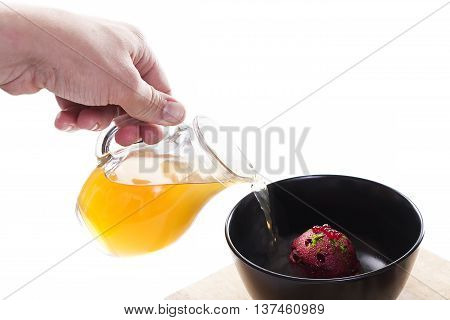 Molecular Cuisine. Delicious modern soup with beetroot. Isolated on white. Stock image.