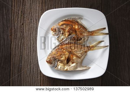deep fried two small pomfret 