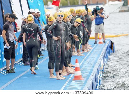 STOCKHOLM - JUL 02 2016: The female swimmers just before the start signal in the Women's ITU World Triathlon series event July 02 2016 in Stockholm Sweden