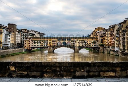 Perspective view of Old Ponte Vecchio Bridge on dull day, Florence, Tuscany region, Italy