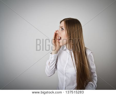 Woman in white is screaming at something.