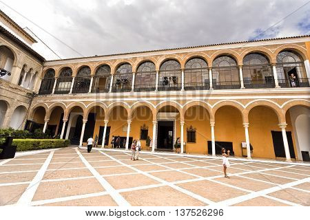 SEVILLE, SPAIN - September 12, 2015: View of the House of Trade (Casa de Contratacion) and the Patio de la Monteria in the Alcazar of Seville on September 12, 2015 in Seville, Spain