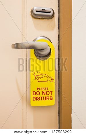 Please do not disturb sign hang on door knob in hotel