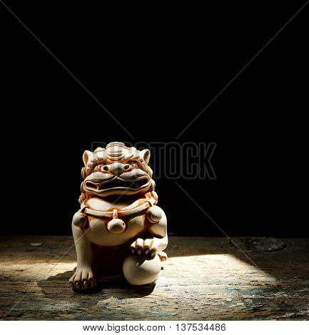 Chinese lion. Netsuke of a lion of a Buddha. Netsuke of a lion